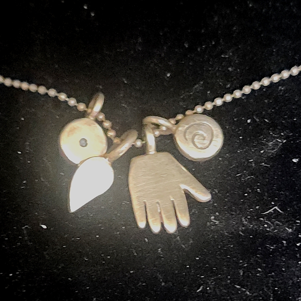 Silver Charm Necklace with Hand and Spiral Pendants By Jane Diaz
